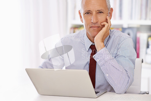 Image of Laptop, portrait and senior businessman in office thinking, planning or checking email, review or social media feedback. Face, calm or old male executive with pc for online, research or communication