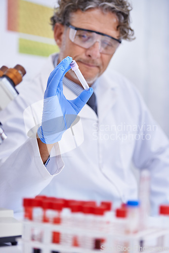 Image of Scientist, blood and container in laboratory, healthcare facility and chemistry for medical research. Male person, science expert and doctor with results for analysis, dna or study in test tube