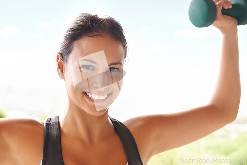 Image of Portrait, dumbbell and happy woman outdoor for exercise, training or workout for power. Face, muscle and strong person weightlifting for fitness, health or bodybuilding to flex for wellness at park