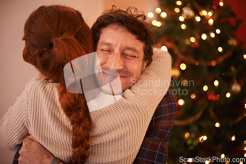 Image of Couple, Christmas and hug to celebrate holiday, festive season of giving for love and commitment. Happiness, gratitude and support with people at home, romance and relationship with peace together