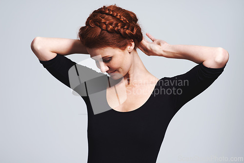 Image of Woman, hair and braid crown for beauty in studio, elegant hairstyle for glamour and redhead on white background. Haircare, shine and texture with model fixing plait, cosmetic care and wellness