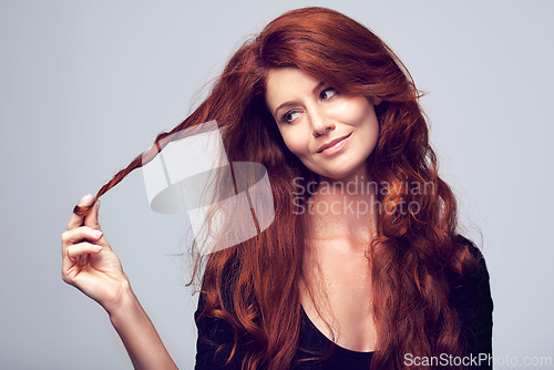 Image of Beauty, face and hair with redhead woman in studio on gray background for natural cosmetic treatment. Skincare, thinking and wellness with happy model at salon for shampoo or keratin haircare