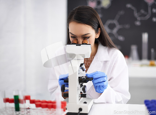 Image of Science, research and doctor in laboratory with microscope for chemistry, results and innovation for medical career. Professional, worker and scientist with container, analysis or particles for study