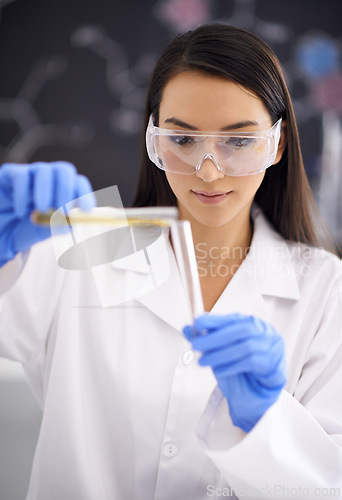 Image of Woman, laboratory and science experiment with test tube for medical research as virus breakthrough, particles or liquid. Female person, ppe and equipment for future innovation, chemical or solution