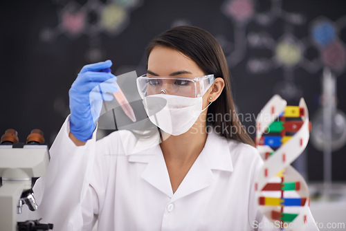 Image of Science, test tube and woman in mask for medical research, experiment and dna. Scientist, glasses and professional with vial for chemistry, biology and check liquid sample for laboratory analysis