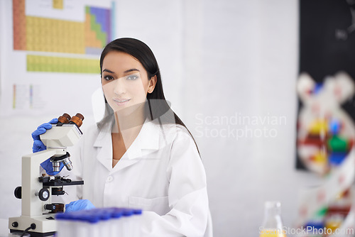 Image of Portrait, scientist and woman with microscope for professional, experiment or test for biology in laboratory. Face, science and medical research with equipment, doctor or technician working in Spain