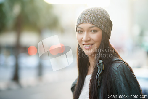 Image of Portrait, smile and beanie with woman, street and happiness with winter and cold with travel and journey. Face, person and outdoor with girl or New York with knitted cap or cheerful with morning walk