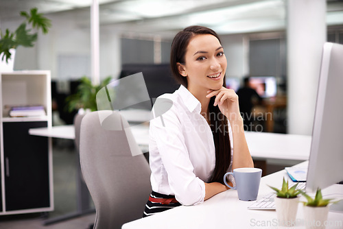 Image of Office, smile and portrait of woman with monitor at desk for research, report review or administration. Happy, face and employee with technology for hr, compliance and ready for work with coffee