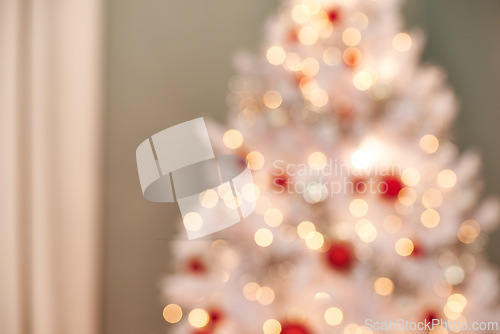 Image of Christmas, tree and ornaments in living room with blur, holiday or preparation for festive season. Morning, bokeh and tradition for decoration, xmas and December winter vacation in apartment
