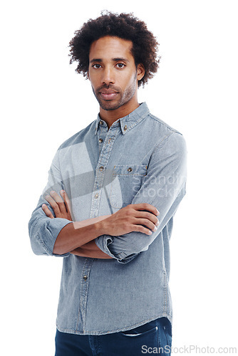 Image of Fashion, crossed arms and portrait of man in studio with casual, trendy and denim shirt outfit. Serious, confident and young male person from Colombia with cool style isolated by white background.