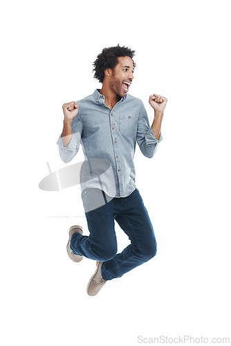 Image of Happy, excited and man jumping in studio with good news, winning and job promotion celebration. Smile, cheering and young male person with enthusiasm for positive attitude by white background.