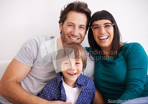 Image of Happy family, portrait and love on sofa to relax, weekend and bonding together in living room. Parents, children and smile face for affection in trust and care on school vacation to embrace in house