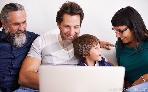 Image of Family, laptop and young boy or streaming on couch, smile and bonding in living room. Video call, technology and happy grandfather with parents on sofa, computer and communication online in lounge