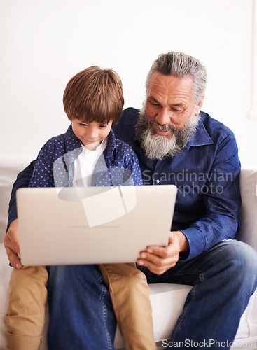 Image of Grandfather, son and laptop on sofa with love and bonding together with online games in living room. Happy family, boy and computer for cartoons in lounge, relax and movie subscription on holiday