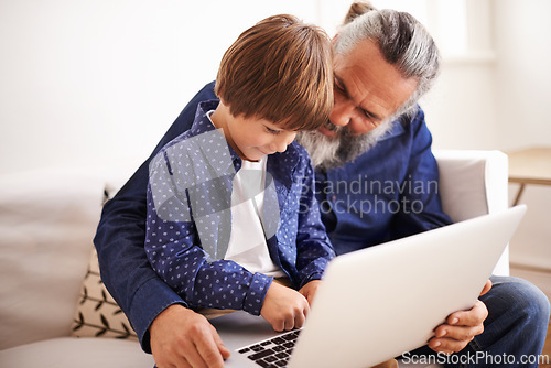 Image of Grandfather, son and laptop on couch with love and bonding together with online games in living room. Happy family, boy and computer for cartoons in lounge, relax and movie subscription on holiday