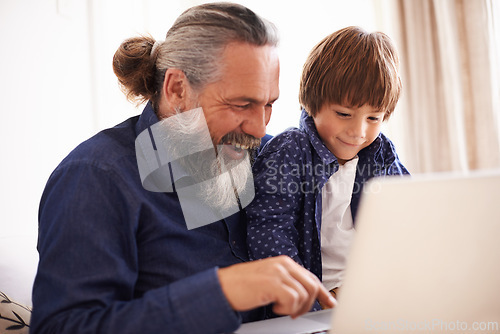 Image of Smile, laptop and grandfather with boy and games, playing and fun in home living room. Happy, streaming or elearning online and internet in house with child, technology and computer for learning