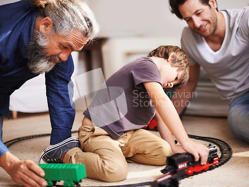 Image of Men, boy and playing with train toys, together for family time and fun with plastic railway track at home. Grandfather, father and kid with generations for games, playful and happy with bonding