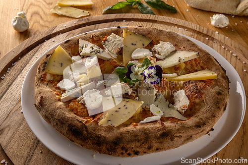 Image of Delicious artisanal four-cheese pizza