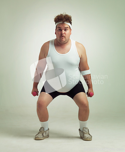 Image of Man, portrait and dumbbell in studio for squat, plus size and exercise for weight loss on background. Male person, training and gym equipment for health, challenge and body development for fitness