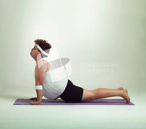 Image of Man, plus size and stretch with mat in studio on white background with exercise or workout and fitness. Healthy, lifestyle and progress with body positivity for self care, wellness and wellbeing