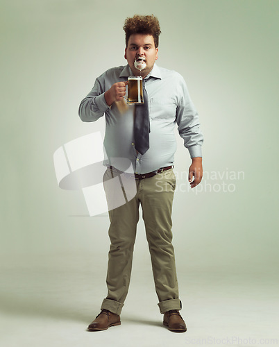 Image of Man, portrait and face with beer foam, drink or party in obesity on a studio background. Male person or plus size model with glass, mug or alcohol in satisfaction for wine or booze on mockup space