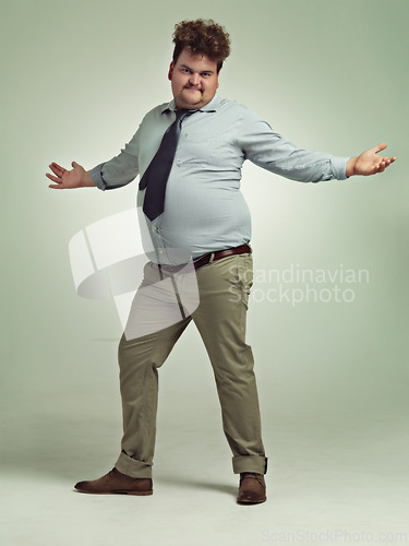 Image of Plus size, arms and portrait of man, excited and happiness with energy in studio with background. Adult, male person and guy with confidence, professional and employee with smile, joy and positive