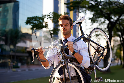 Image of Morning, business man and bicycle for transportation, commute and carbon neutral in city. Professional, sustainable and male worker walking with bike for travel, journey or eco friendly in urban town