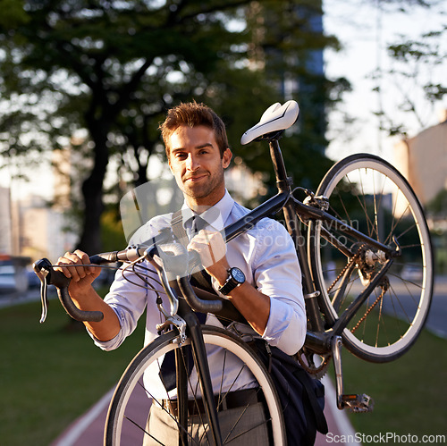 Image of Bicycle, portrait and business man for commute, transportation and carbon neutral in city. Professional, sustainable and face of male employee walking with bike for travel, journey or eco friendly