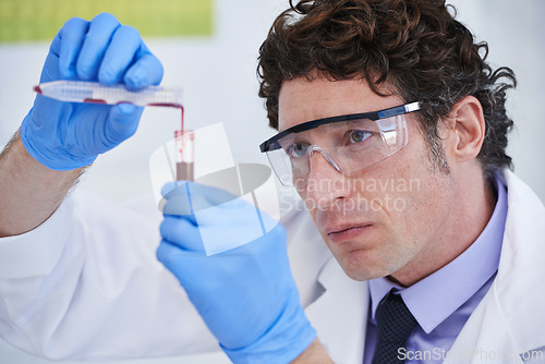 Image of Science, study and man with blood in test tube for biotech engineering, pathology and analysis. Laboratory, investigation and scientist checking DNA sample for medical research in vaccine development