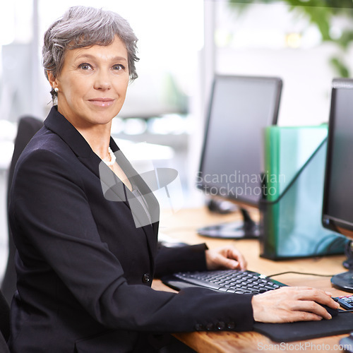 Image of Business woman, portrait and senior professional in office with manager at computer with a smile for digital work. Tech, desk and happy executive with online job and confidence from accountant career