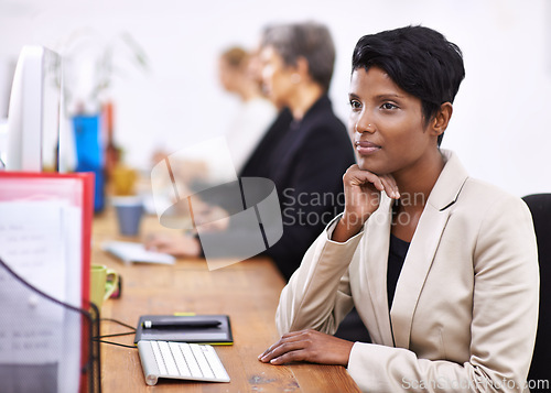 Image of Business woman, thinking and planning with computer at office for career, job or vision. Female person or employee in wonder or thought for planning, brainstorming or schedule reminder at workplace