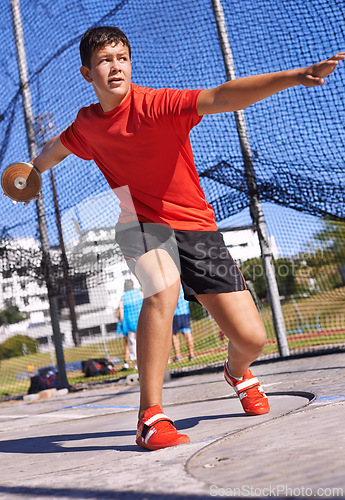 Image of Discus, young man and sportsman throw in competition, championship or training for outdoor field event. Sports, metal disc and male person for fitness, athletics and tournament in strong contest