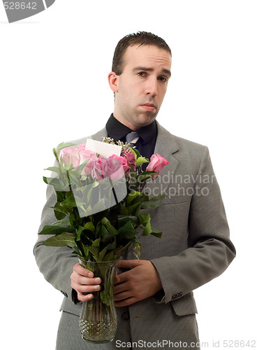 Image of Sad Man With Flowers