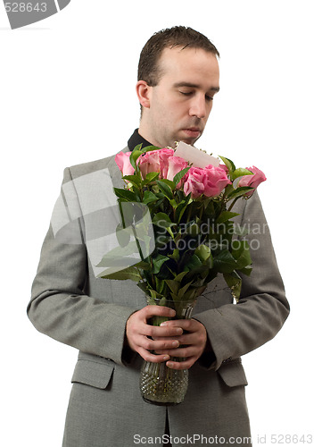 Image of Man Smelling Roses