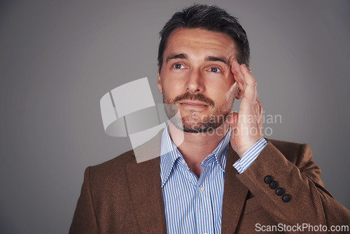 Image of Thinking, headache and business man on gray background for problem solving, brainstorming or solution. Professional, corporate and isolated person with stress for career, job and work in studio