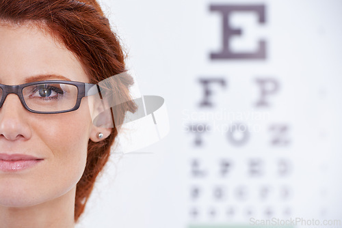 Image of Woman, glasses and eye chart or vision consultation or prescription lens for eyewear health, examination or checkup. Female person, frame and optical test or wellness or letters, diagnosis or reading