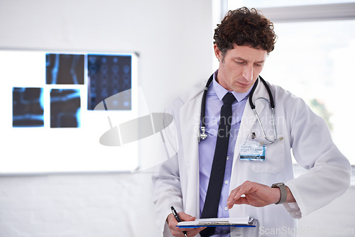 Image of Doctor, man and check time in hospital with clipboard for neurology with thinking, schedule or planning. Medic, checklist and watch or wristwatch with document, idea or review for healthcare results