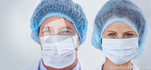 Image of Face mask, doctors and portrait with surgery and safety gear for healthcare and wellness job. Hospital, ppe and people in clinic with working and health protocol in facility with care and staff