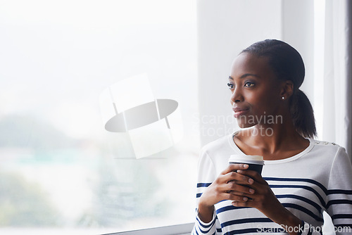 Image of Woman, coffee and thinking by window in new house with confidence for real estate investment and mortgage. African homeowner, person and thoughtful with future home ideas or relocation in living room