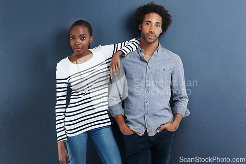 Image of Fashion, portrait and cool black couple in studio with love and support on gray background together with pride. African, people and casual clothes or confident in style on date with wall mockup space