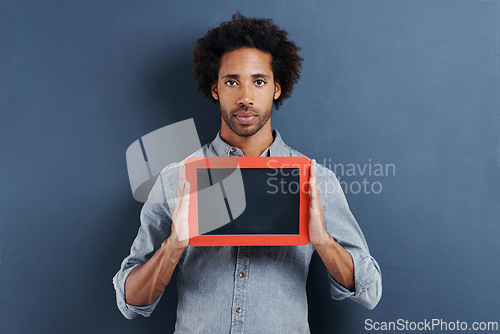 Image of Portrait, man or blackboard with mockup in studio for news, announcement or offer on blue background. Frame, presentation or face of guy model show space for promotion, info or sign up, guide or deal