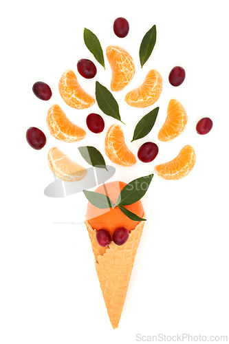 Image of Surreal Ice Cream Cone Cranberry and Tangerine Fruit Concept