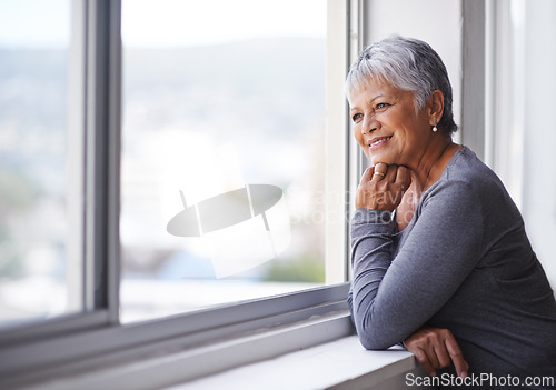 Image of Window, senior woman and thinking with smile, home and retirement with peace and problem solving. Old person, elderly lady and pensioner with view or happiness with nostalgia and solution with choice