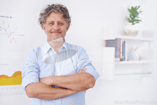 Image of Businessman, smile and portrait in office for boss and career for organization, agency or company. Executive and happy with male person with arm fold for confidence and profession for data on graph