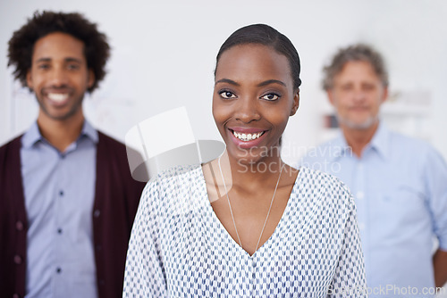 Image of Woman, smile and portrait in office with colleagues for collaborartion, research and career for organisation, agency or company. Diverse, team and coworkers for planning, teamwork and profession