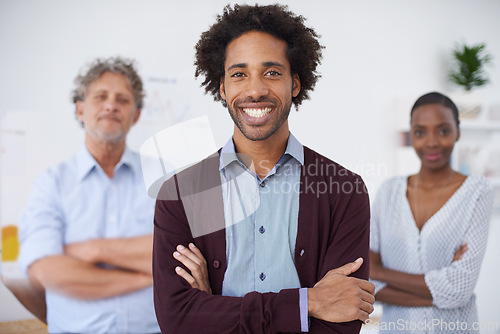 Image of Man, smile and portrait in office with colleagues for meeting, research and career for organisation, agency or company. Diverse, team and coworkers for planning, teamwork and profession for collab