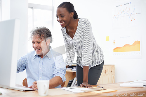 Image of Intern, mentor or employer in office with computer for internet, jokes and guide online in morning or indoor. Coworker, tech and desk with coffee and laugh for research, collaboration or career