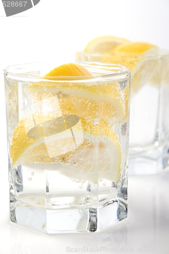 Image of glasses with soda water and lemon