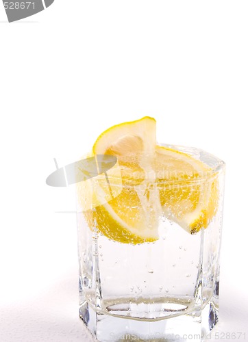 Image of glass with soda water and lemon