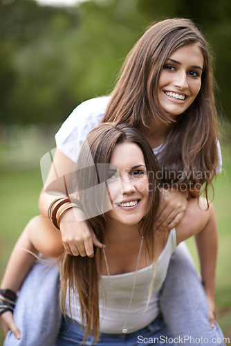 Image of Portrait, smile and couple of friends with piggyback ride for bonding, adventure and summer vacation in outdoor. Happy, relax and woman carrying lady for fresh air, support and park together